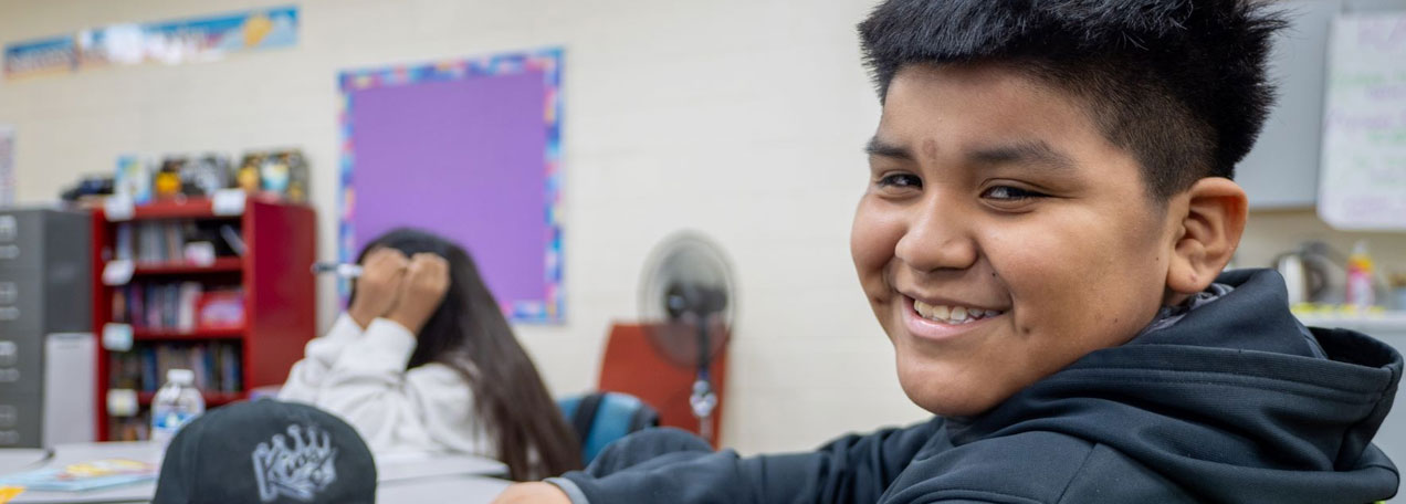 Male student smiling at the camera. 